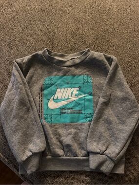Nike Gray Sweatshirt with Teal Graphic and White Swoosh